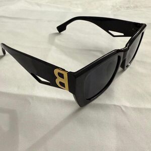 Black rectangular sunglasses with gold B